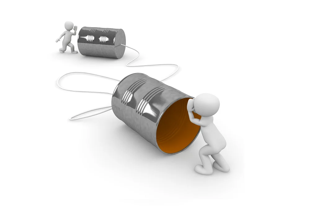 3D figures using tin can telephones connected by string, symbolizing communication and connection